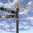 road signs showing work life balance in three directions