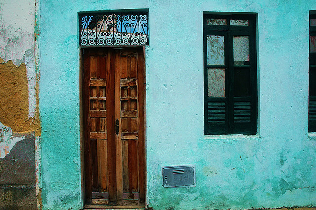 brown wooden door of house painted teal on the island of Itaparica