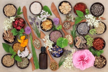 colorful variety of flowers and oils for alternative health products