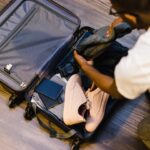 traveler packing suitcase